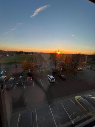 a view of a parking lot with cars parked at AEROPARTMENT & AEROTEL, London Heathrow Airport, Terminal 4, EV Stations & Cheap Parking on site! in West Bedfont