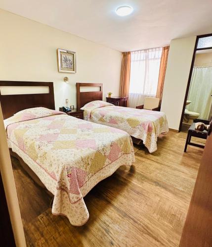 Postel nebo postele na pokoji v ubytování Arequipa Inn