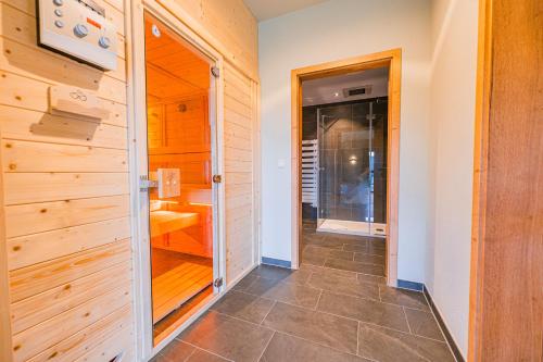 a bathroom with a walk in shower and a toilet at Bergglück in Seiffen