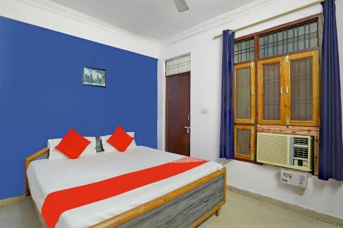 Llit o llits en una habitació de OYO Flagship Hotel Drip Inn