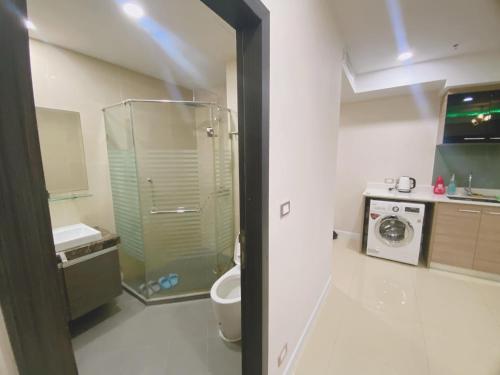 a bathroom with a glass shower and a toilet at dusit grand condo view高层海景房 in Jomtien Beach