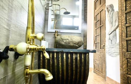 a bathroom with a sink and a mirror on the wall at HELLO VILLA & SPA in Hue