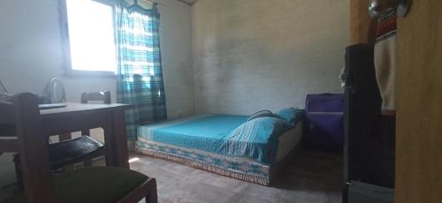 Ένα ή περισσότερα κρεβάτια σε δωμάτιο στο Punta del diablo Casa