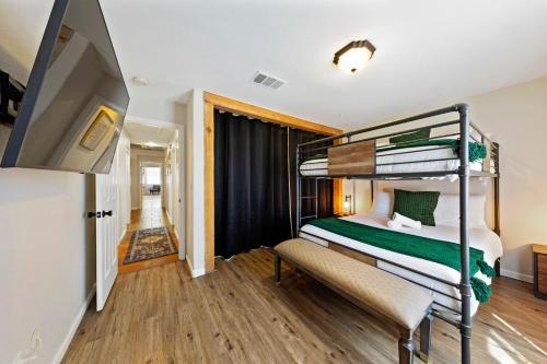 a bedroom with two bunk beds and a hallway at Ultimate Vacation: A Luxurious Oasis with a Pool! in Las Vegas