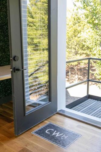 an open door with a view of a balcony at Tiger Mansion-Paradise with Pool in Waxahachie