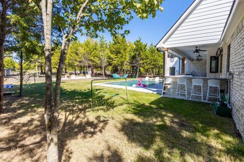 a house with a yard with a playground at Tiger Mansion-Paradise with Pool in Waxahachie