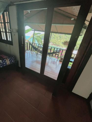 an open room with a view of a wooden deck at Silver cliff room 3 in Than Sadet Beach