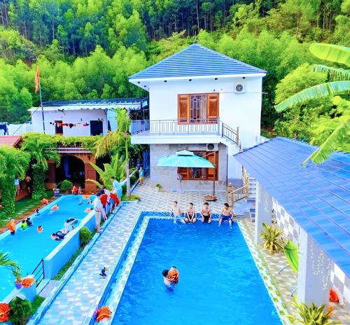 an overhead view of a pool at a resort at The Hillside Homes in Phong Nha