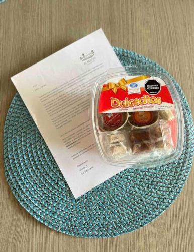 a plastic container of snacks on a plate at EL PAILON FINCA in Quebradaseca