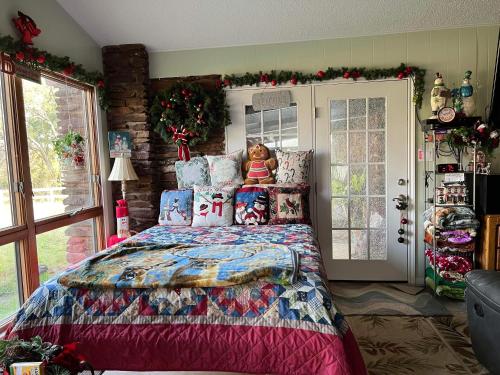 a bedroom with a bed with a teddy bear on it at Fishers Of Men Ranch Home in Marble Falls