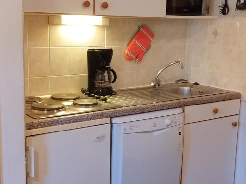 a kitchen with a sink and a counter top at Appartement Les Adrets-Prapoutel, 2 pièces, 4 personnes - FR-1-771-31 in Les Adrets