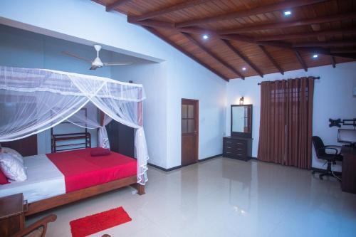 Ένα ή περισσότερα κρεβάτια σε δωμάτιο στο Relax Villa Koggala