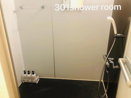 a shower door in a bathroom with a shower room at 冠京ホテル in Tokyo