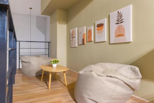 a living room with a couch and a table at Arte Cheras at Kuala Lumpur in Kuala Lumpur