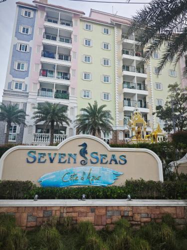 a sign in front of a large apartment building at Seven Seas Cote d'Azur, Jomtien Beach Pattaya in Na Jomtien