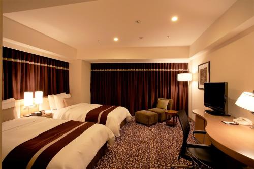 Ένα ή περισσότερα κρεβάτια σε δωμάτιο στο Hotel Ryumeikan Tokyo