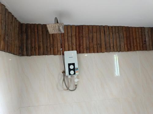 a room with a cell phone on the wall at Sunny Bungalow in Koh Rong Sanloem