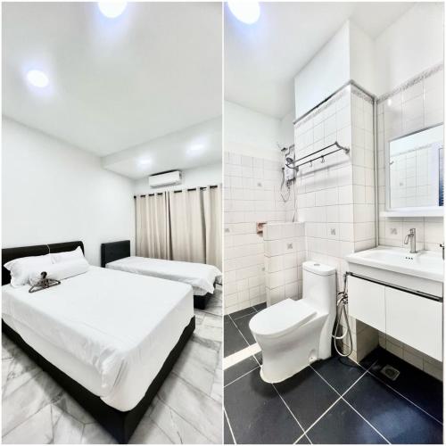 a hotel room with a bed and a sink at Three Homestay in Perai