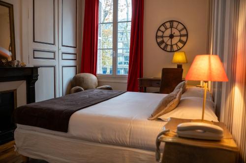 Un ou plusieurs lits dans un hébergement de l'établissement Hotel Val De Loire