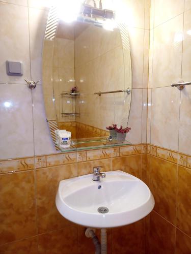 a bathroom with a sink and a mirror at "Maria Luisa" - Top center apartment in Sofia