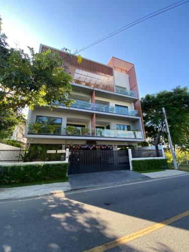 a building on the side of a street at Bann Chidtha family suite full kitchen near Suvarnabhumi Airport in Bangkok