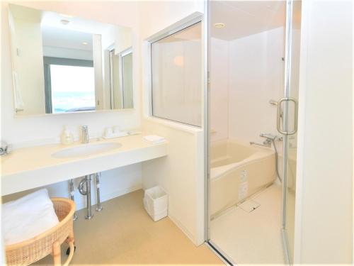 a bathroom with a sink and a shower at J - HOTEL RINKU - Vacation STAY 42900v in Tokoname