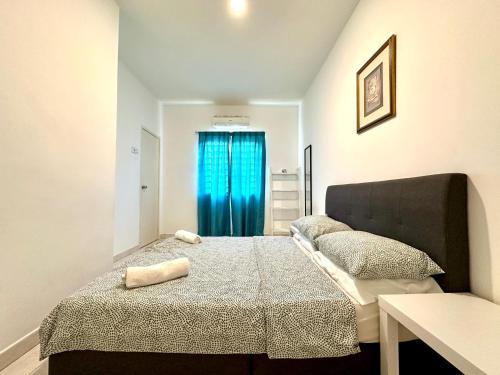 Giường trong phòng chung tại BNB Cozy Homestay - Emerald West Rawang