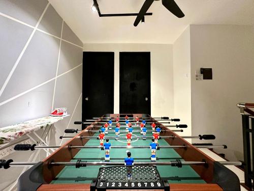 a gym with a long table with people in it at BNB Cozy Homestay @ Cyberjaya in Cyberjaya