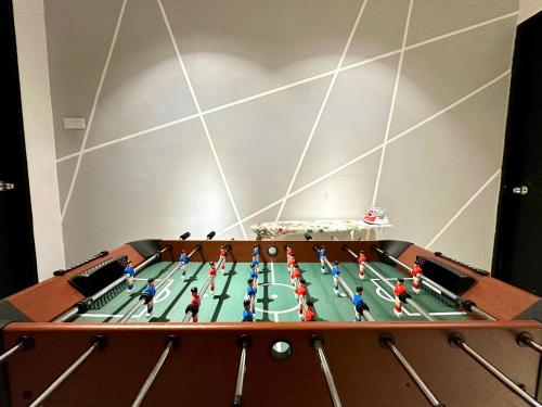 a view of a table with a soccer game at BNB Cozy Homestay @ Cyberjaya in Cyberjaya