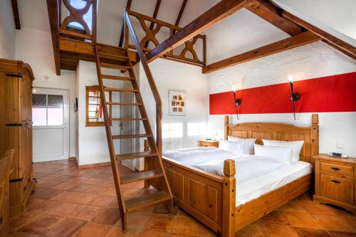 a bedroom with a wooden bunk bed with a ladder at Zum Schlangenkönig in Burg