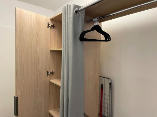 a shower in a room with a shower curtain at Le Séquoia - Maison individuelle, Terrasse, Parking privé in Saix