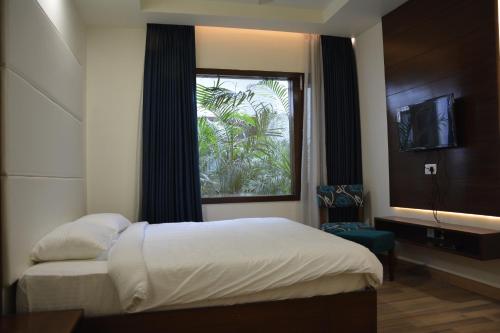 Ένα ή περισσότερα κρεβάτια σε δωμάτιο στο Green Hotel & Restaurant