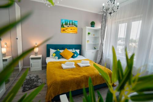 a bedroom with a bed with two pillows on it at Chic Studio Old City Center - IVO19 in Bucharest
