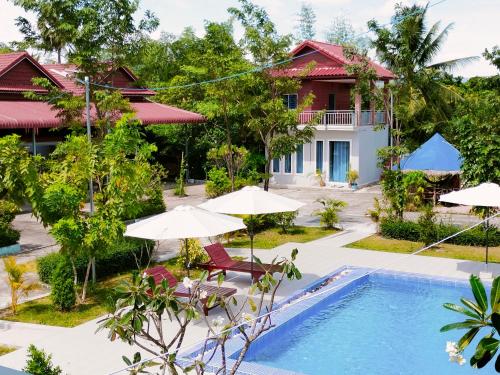 an image of a villa with a swimming pool and a house at Kampot Nature Villa Resort in Kampot