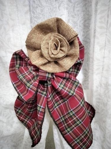 a red and tan bow tie with a plaid at Calypso in Cefalù