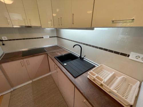 Una cocina o cocineta en Apartman Sarajevo - Kovači