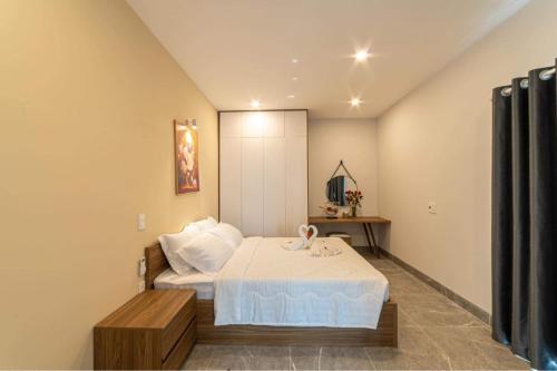 Postel nebo postele na pokoji v ubytování Sweet Home gần bãi sau