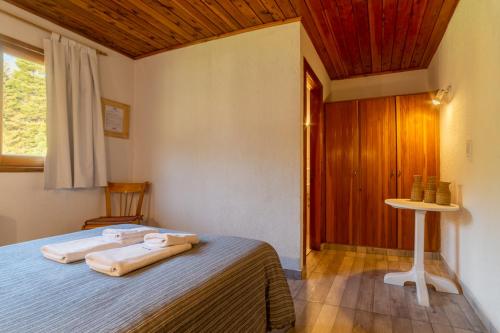 Postel nebo postele na pokoji v ubytování Cabañas y Hosteria Aldea Los Huemules