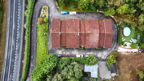 an overhead view of a group of buildings next to a road at Hotel Apartamentos Rock Star in Taboadela