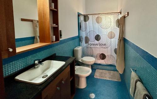 a bathroom with a toilet and a sink at Palombella - Stella Maris Exclusive in Calheta Do Maio