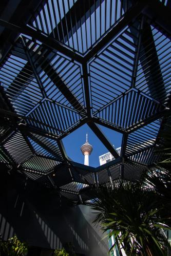 a view of the eiffel tower through the roof of a building at Hotel Indigo Kuala Lumpur on the Park by IHG in Kuala Lumpur