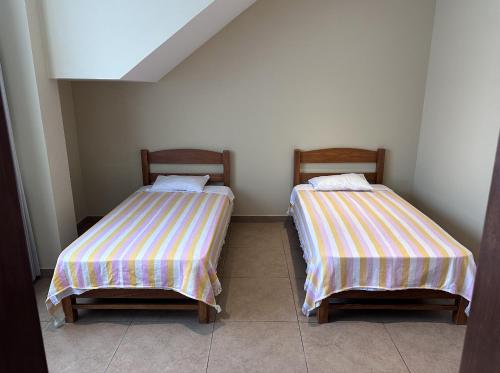 Ένα ή περισσότερα κρεβάτια σε δωμάτιο στο YOLO House Peru