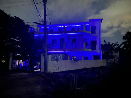 a house with blue lights on the side of it at 5 Min Walk To Famous Blue Water Resort And Tourist Area in Maribago