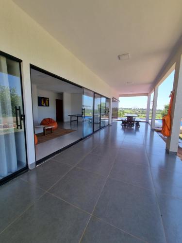 an empty room with a large floor of glass at Chácara Lótus in Trindade