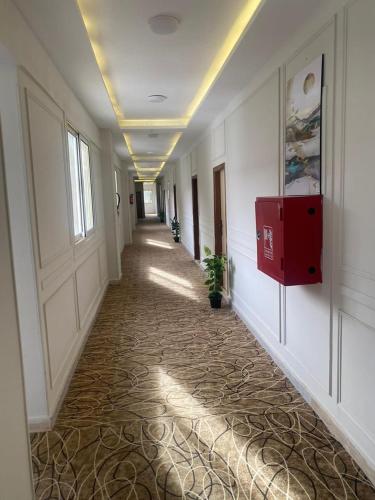 a hallway of an office building with a long corridor at Nile jewel hotel beni suef in Beni Suef