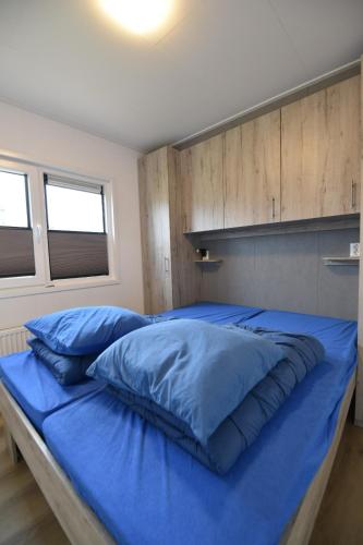 Ένα ή περισσότερα κρεβάτια σε δωμάτιο στο Chalet Helmgras J4