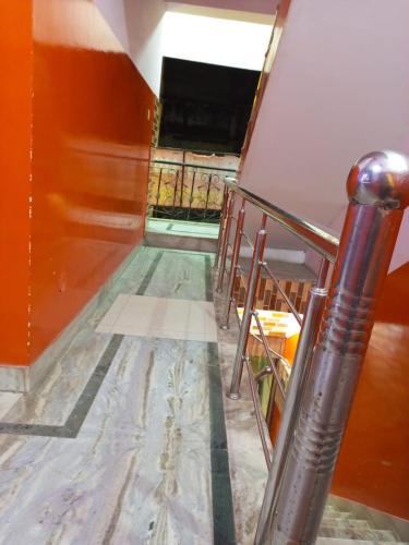 a staircase in a room with a stair railing at HOTEL NEW APPLE ROSE in Chandīgarh