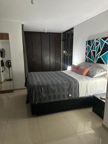 a bedroom with a large bed in a room at apartamento completo en Cañaveral in Cañaveral