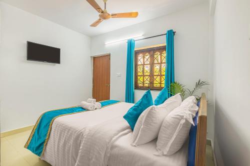 Cama ou camas em um quarto em The Sequeira Goa