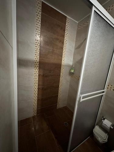 a shower with a glass door in a bathroom at apartamento completo en Cañaveral in Cañaveral